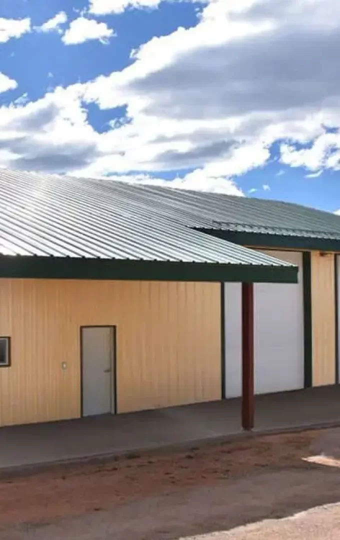 painted cfs workshop steel building with entry and garage doors