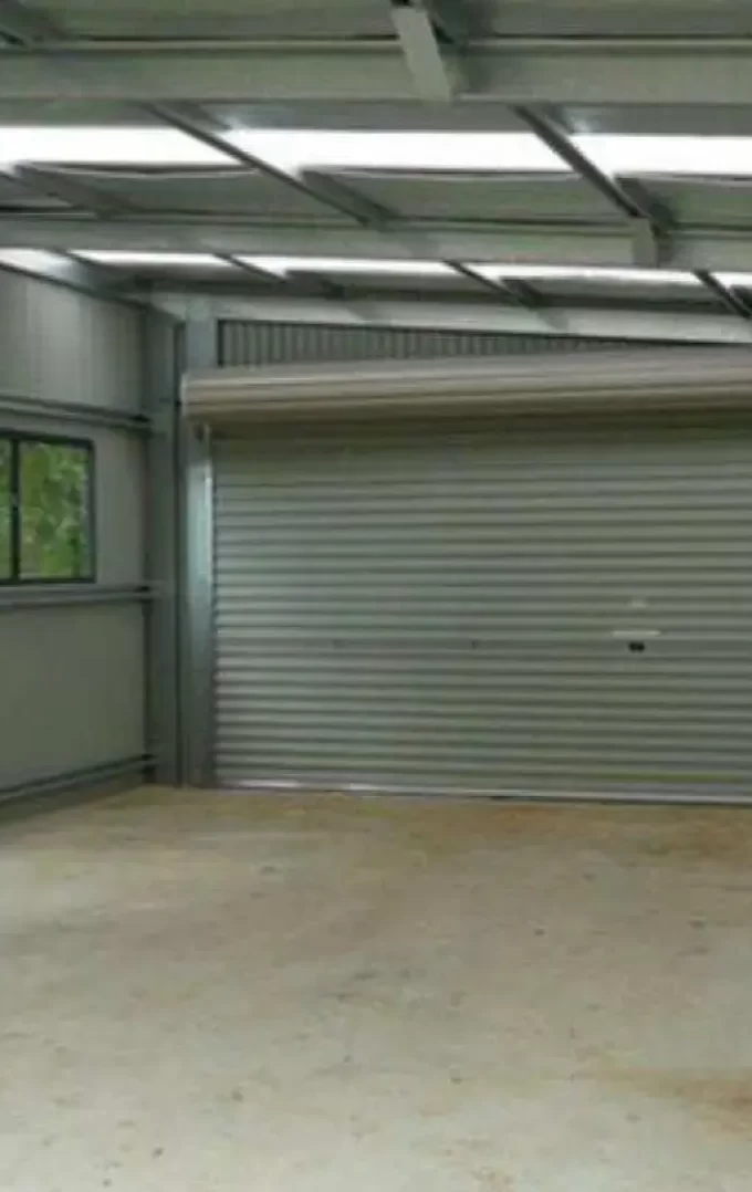 interior of a steel shed building with windows