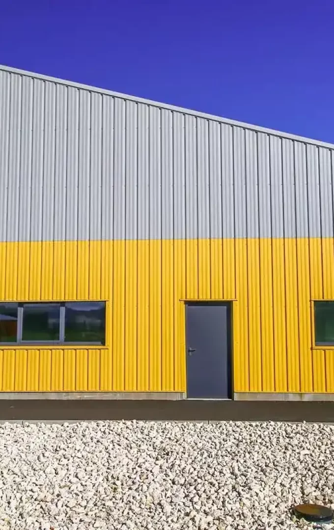 steel office building with yellow and grey coloured wall liners